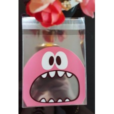 Celofánový sáčok s lepiacim pásikom „Zubaté strašidlo -ružové“